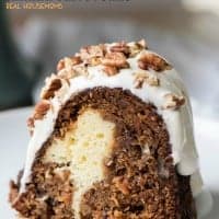 Cream Cheese Stuffed Banana Carrot Cake is a showstopper! It's a mashup of banana bread, carrot cake and cheese cake all in one amazing dessert!
