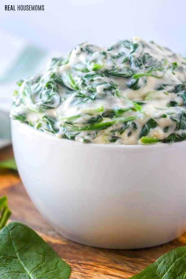 side view of a bowl of creamed spinach