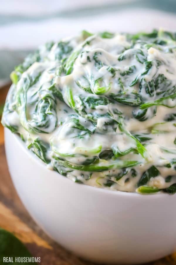 close up of a bowl of creamed spinach