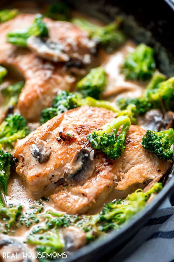 Cooked Creamy Broccoli and Mushroom Chicken in a cast iron skillet