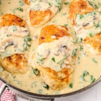 square image looking down into a skillet of chicken florentine