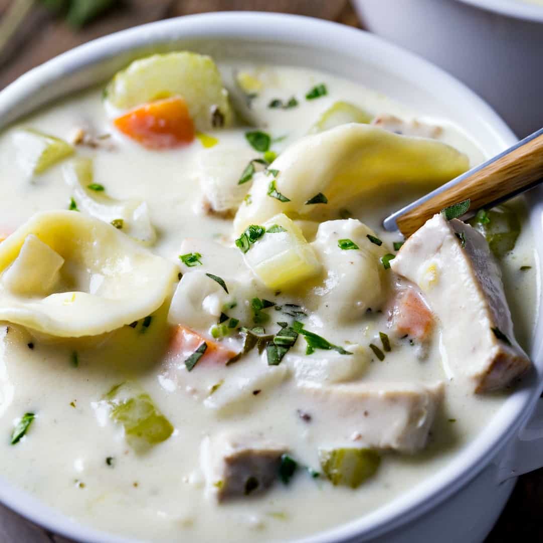 Creamy Chicken Tortellini Soup is absolutely delicious and perfect for cold weather! It's packed with hearty veggies, rotisserie chicken, and cheesy tortellini that will have you savoring every last bite.