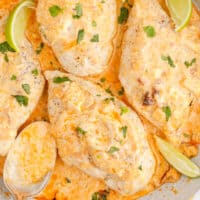 square image of creamy chipotle chicken in a skillet next to a spoon of sauce