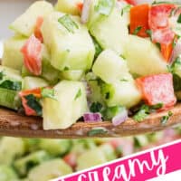 close up of a serving spoonful of creamy cucumber salsa with the title of the post on the bottom left corner