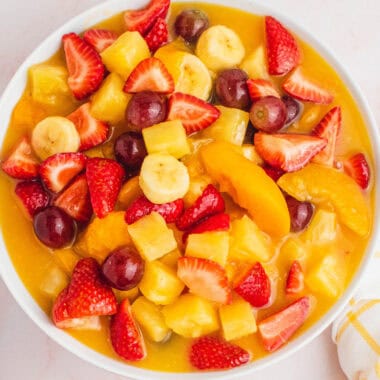 square image of fruit salad with vanilla pudding in a serving bowl