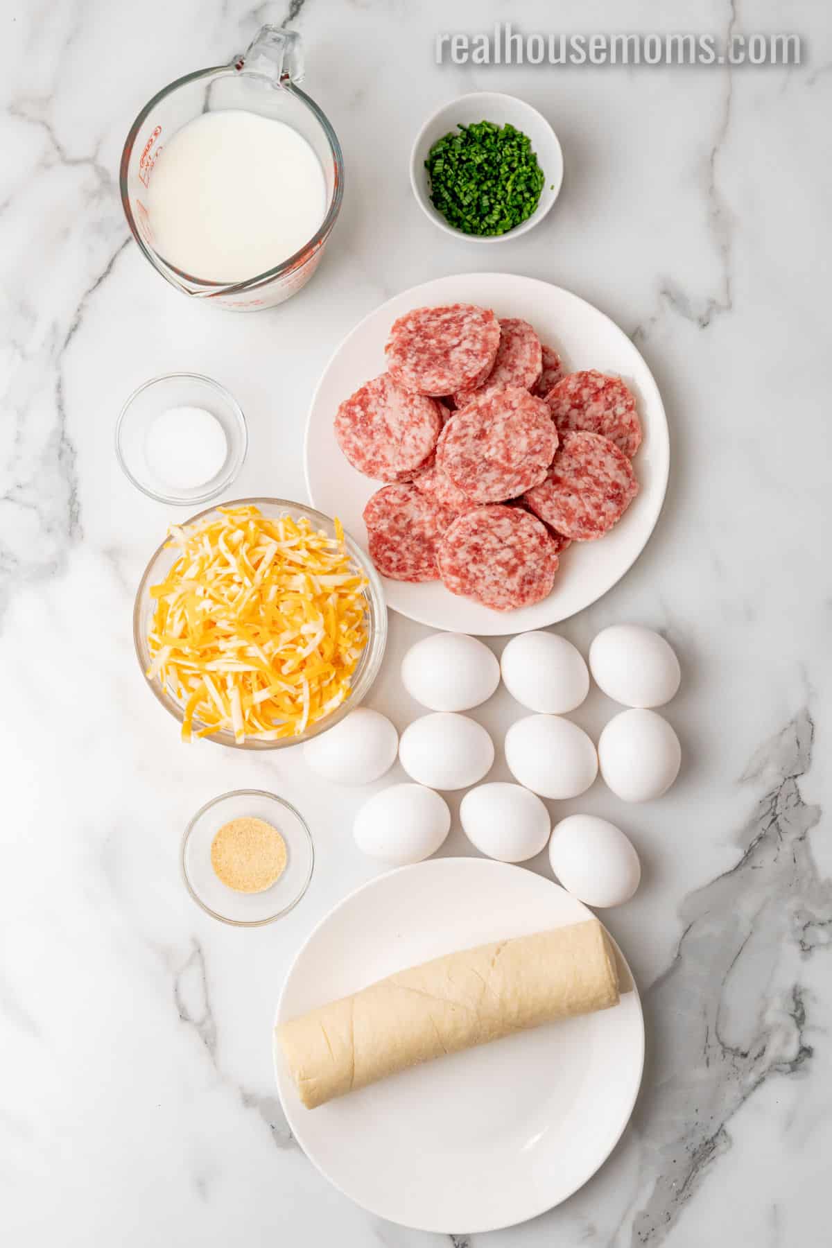 ingredients to make crescent roll breakfast casserole laid out on a counter