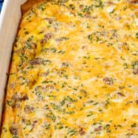 looking down at a crescent roll breakfast casserole with recipe name at the bottom with the title of the post on top right of the image in pink and black lettering