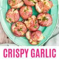 crispy garlic smashed potatoes on a platter with recipe name at the bottom