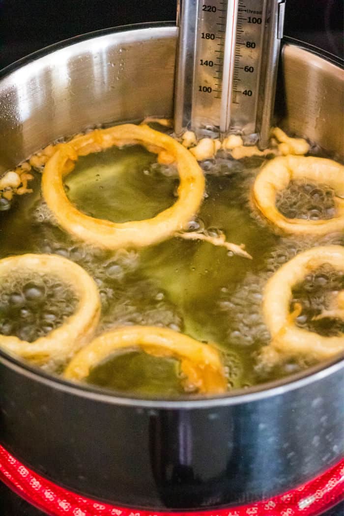 batter dipped onions frying in oil
