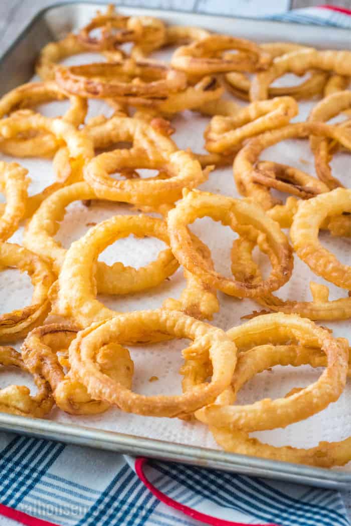onion rings on paper towel lined baking sheet