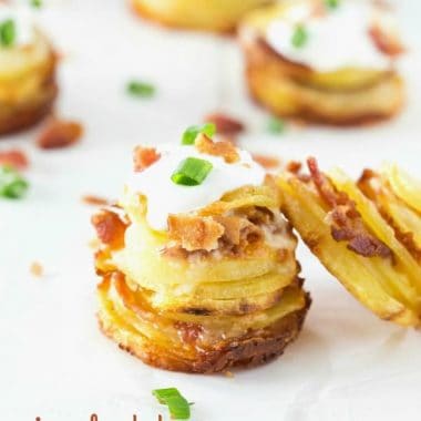 If you can slice and load potatoes with crispy bacon and shredded cheese then you can make these CRISPY LOADED POTATO STACKS! They are perfect as a side dish or serve them at your next party!