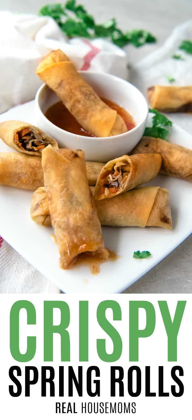 crispy spring rolls on a serving plate, some cut open to show filling