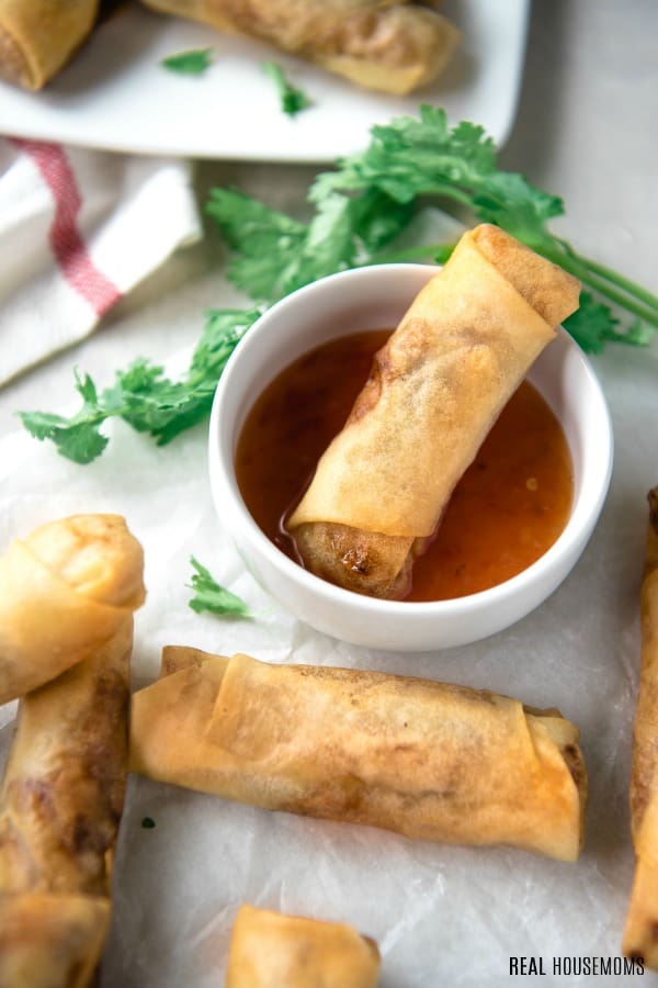 crispy spring roll dipped in sauce