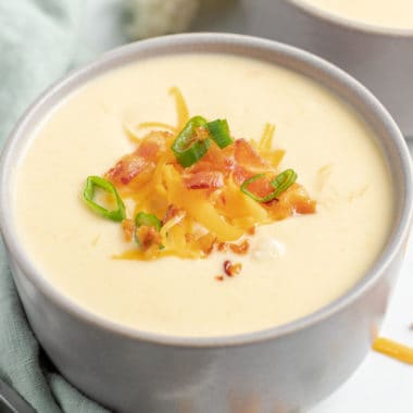 Low carb Crock Pot Cheesy Cauliflower Soup is the ultimate comfort food for chilly nights! It's so delicious and creamy you won't even miss the carbs!
