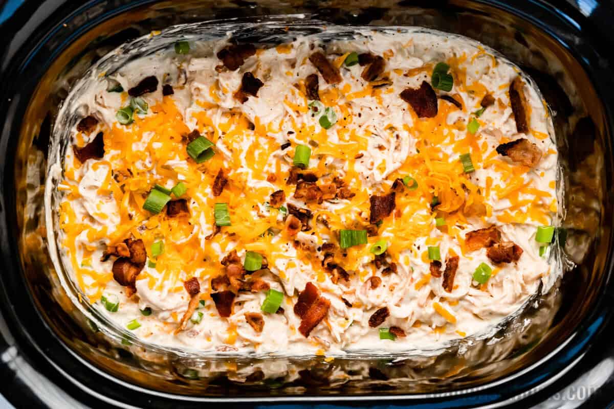 looking down at crock pot crack chicken in a slow cooker