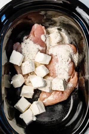 chicken breasts, cream cheese, and ranch dressing mix in a crock pot