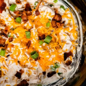 square image close up of crock pot crack chicken in a slow cooker
