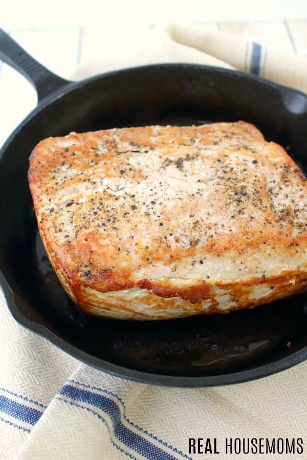 pork roast seared in a cast iron skillet
