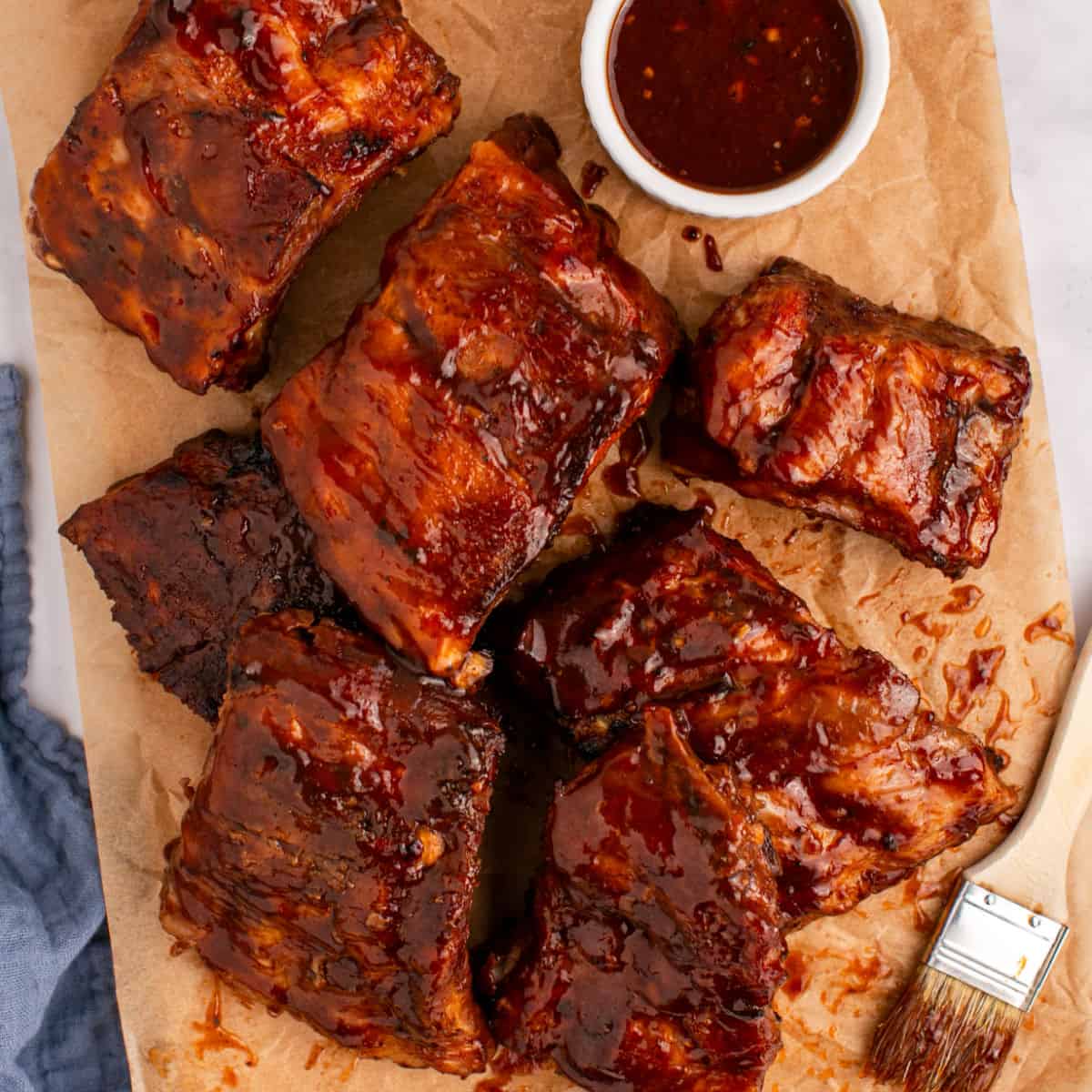 square image of crock pot ribs sections on a cutting board
