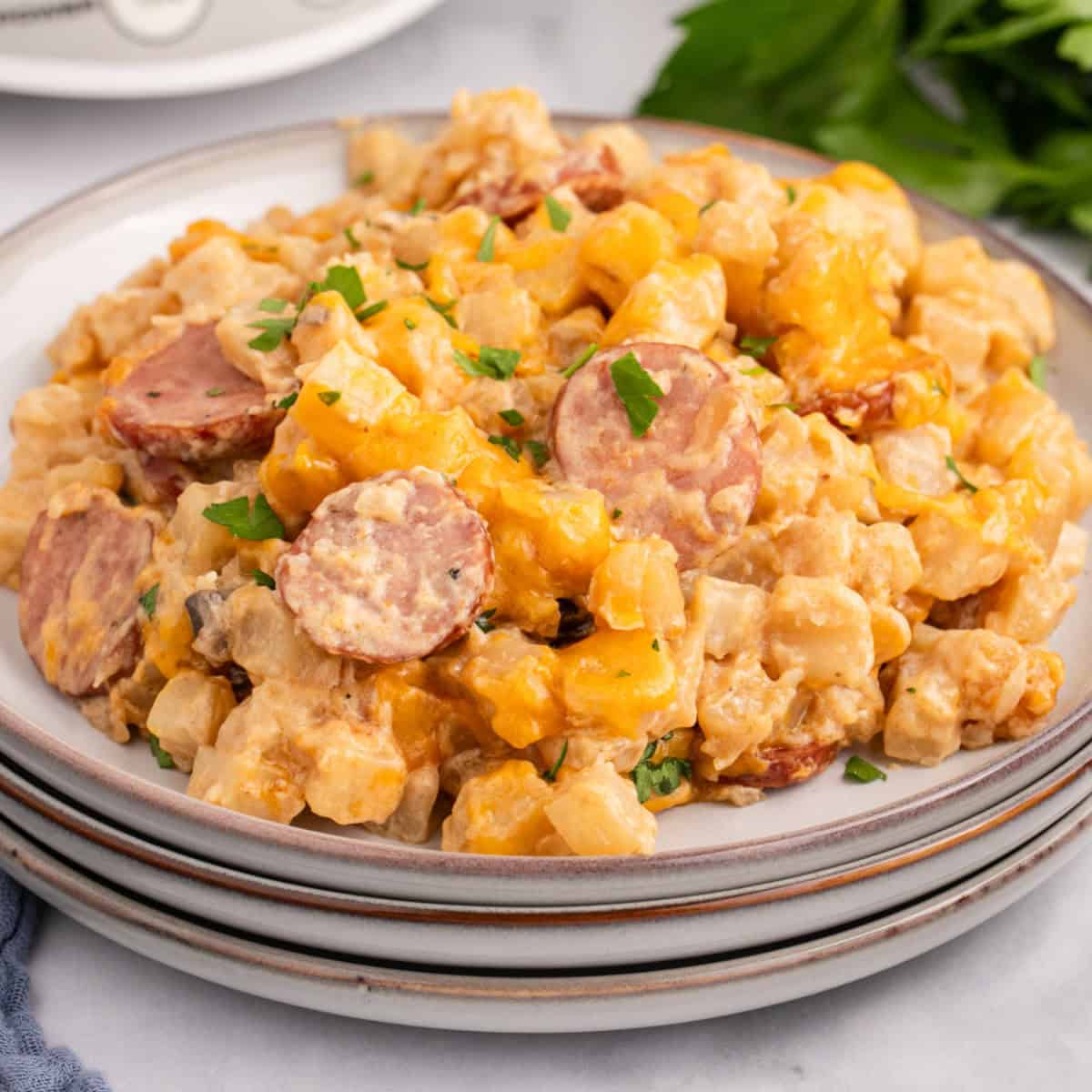 square image of crock pot sausage & potato casserole on a plate