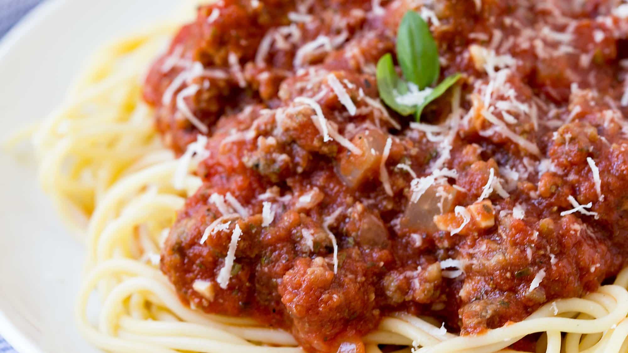 Crock Pot Spaghetti Sauce is an easy dinner recipe to make busy weeknights easier! I keep the ingredients on hand to make when I'll be short on time!