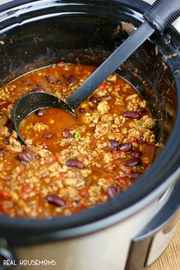 Weight Watchers Chili in the slow cooker just after cooking, with a ladle for serving