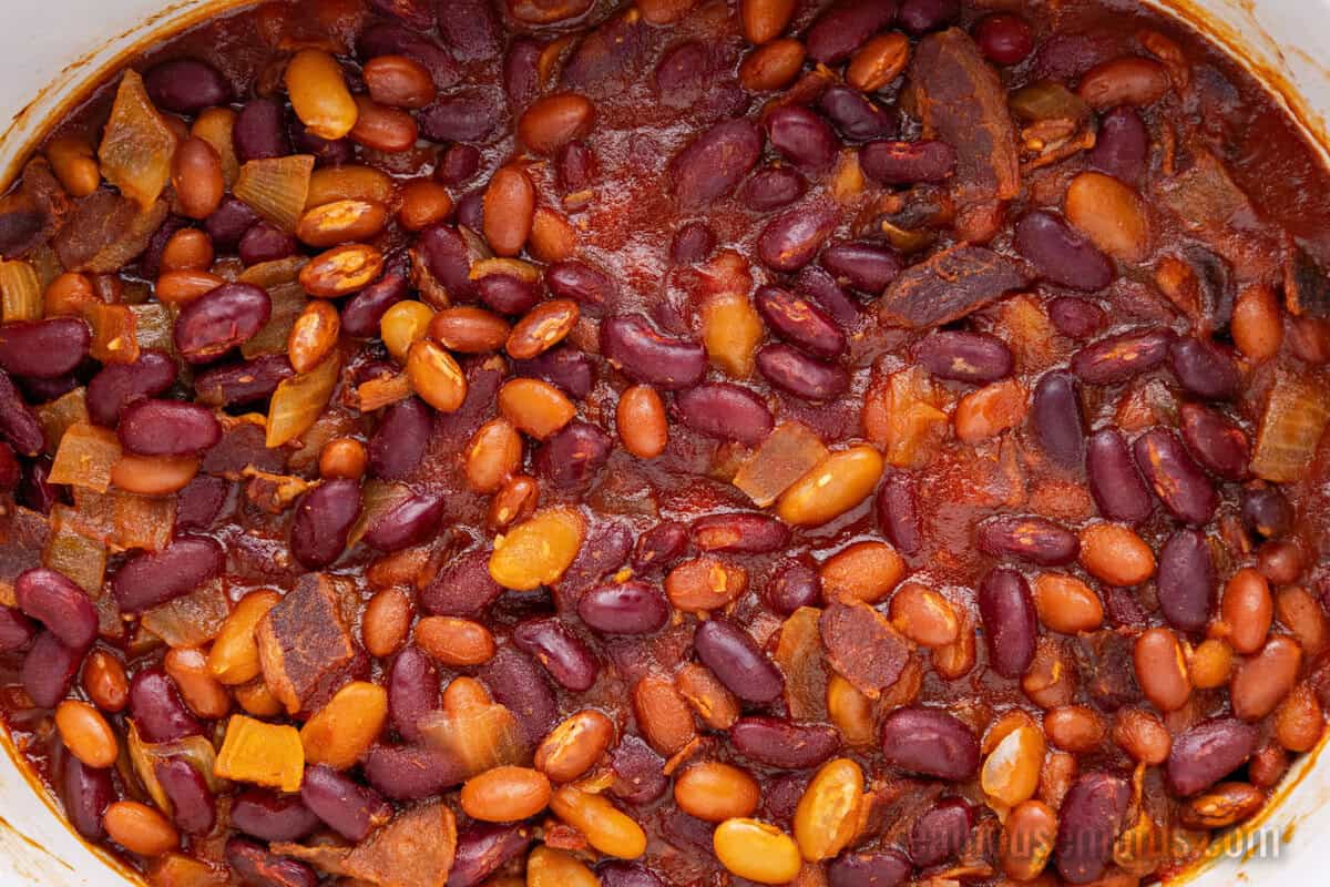 looking down at a slow cooker of baked beans