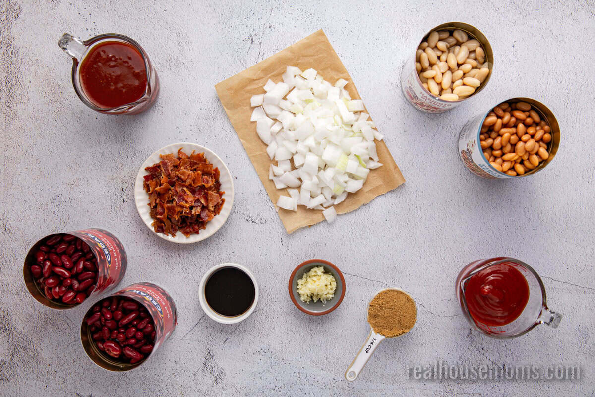 ingredients to make crock pot baked beans laid out on a counter