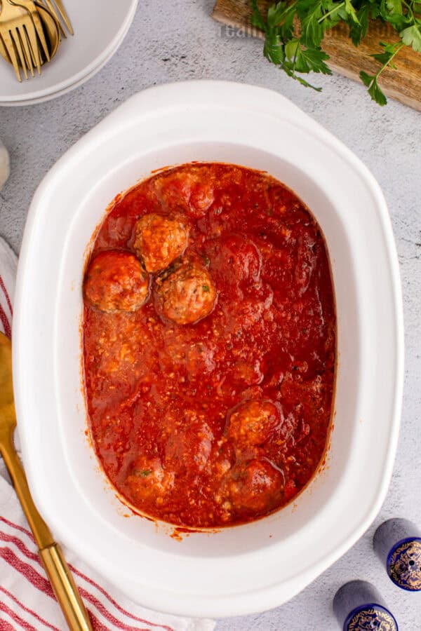 cooked crockpot meatballs in a slow cooker