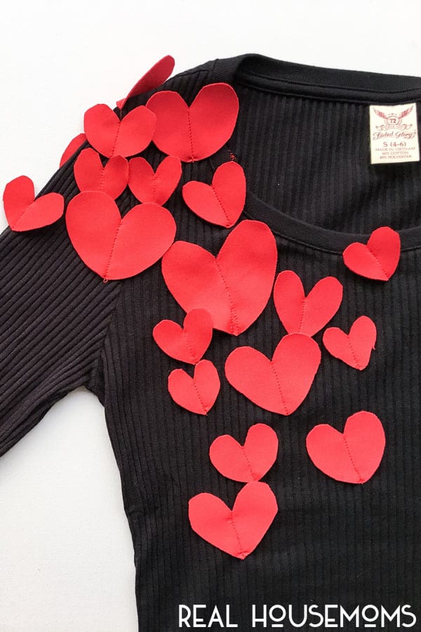 Inspired by Kate Spade and far from banking the bank, create this easy DIY Heart Attack Top this Valentine season! With a little fabric, scissors, and some extra light sewing, you can get Valentine ready in less than 10 minutes!!