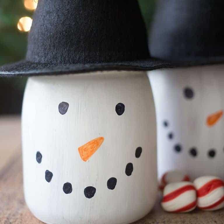Perfect for Christmas crafting and gifting, create these adorable DIY Snowman Gift Jars!