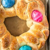 picture of easter bread on a wooden board with the title of the post on top in pink and black lettering