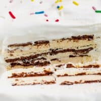square image of ice cream sandwich cake with a slice cut off to show layers