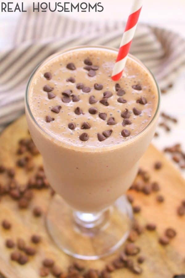Easy Mocha Protein Shake poured into a milkshake glass and garnished with mini chocolate chips on top