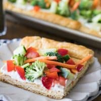 Have you ever tried Easy Veggie Pizza before? With a buttery, crescent-roll dough base and lots of crisp, fresh veggies, this recipe is always a crowd pleaser!