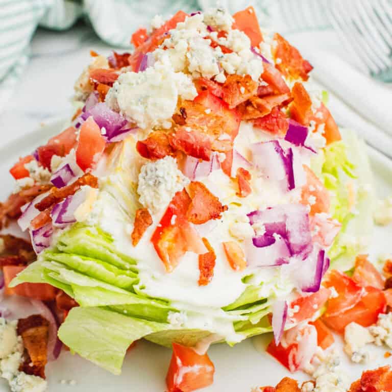 square image of a wedge salad on a plate