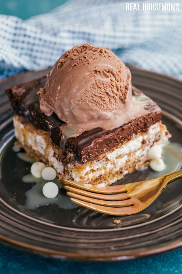 eclair icebox cake topped with a scoop of chocolate ice cream