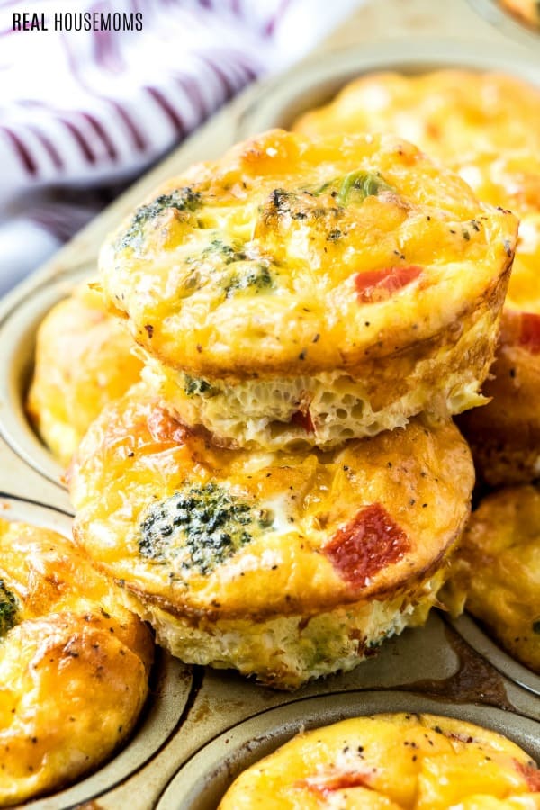 egg muffins stacked on top of a muffin tin