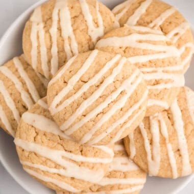 square close up image of eggnog cookies piled on a plate