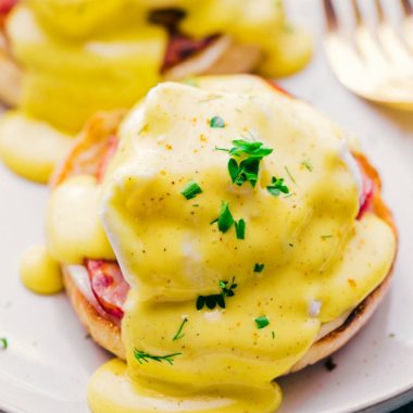 Eggs Benedict with Hollandaise Sauce is layer upon layer creamy, rich decadence with a perfect poached egg. One bite says it all!