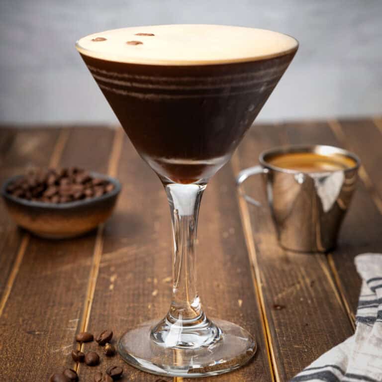square image of an espresso martini next to some espresso beans