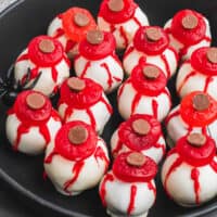 square image of eyeball oreo balls on a black plate