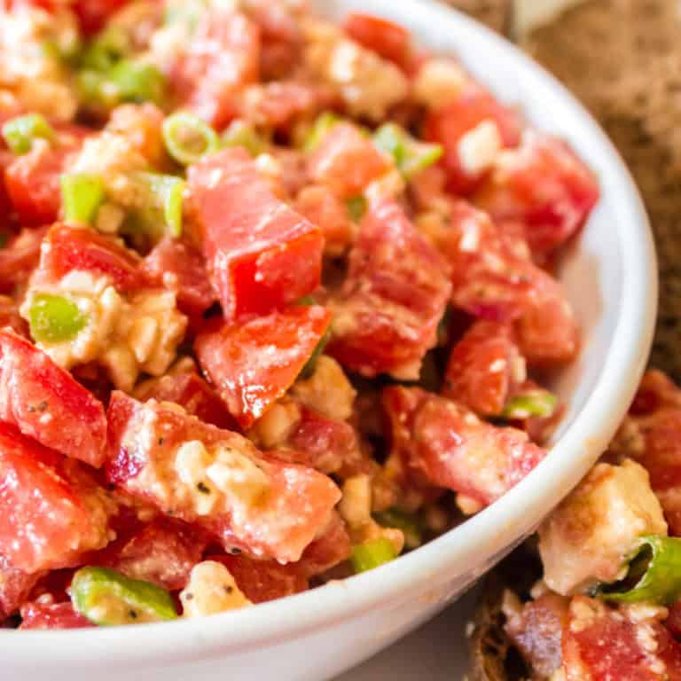Tangy, fresh Feta Dip is an easy appetizer that your guests will eat right up! Everyone will beg for more. Good thing it only takes 5 minutes to make!