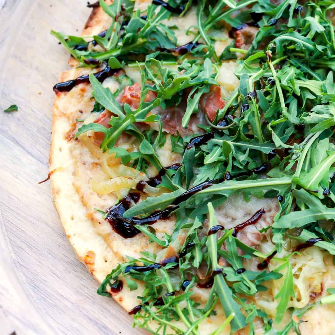 Lighten up dinner with this easy, gourmet Fig & Prosciutto Pizza! Ready in about 20 minutes on the grill or in the oven, it's perfect for summer!