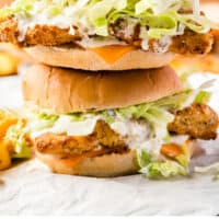 two fish fillet sandwiches stacked on top of each other with recipe name at the bottom