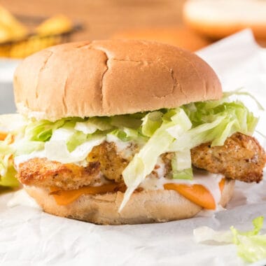 square image of a fish fillet sandwich with homemade tartar sauce