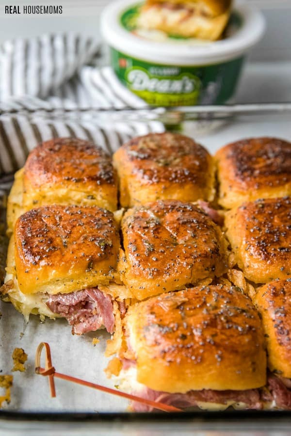 dean's french onion dip roast beef sliders in baking dish