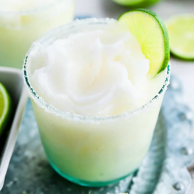 Grab your blender, this easy Frozen Margarita Recipe comes together in minutes! You'll love sipping on this frosty and refreshing cocktail!