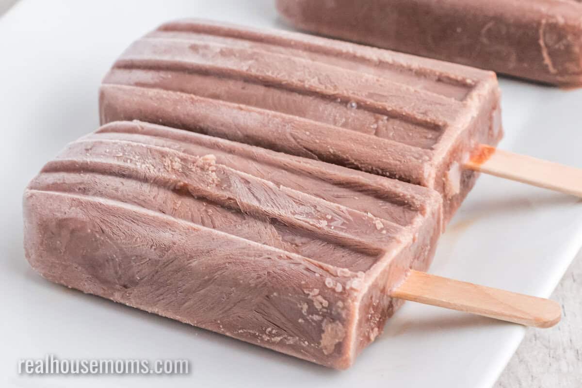 homemade fudgesicles on a white platter