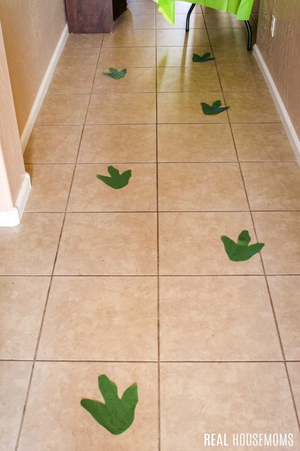 dino footprints leading to dinosaur party